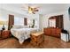 Main bedroom boasts a wood dresser, trunk, and a ceiling fan at 618 Acapulca Way, Altamonte Springs, FL 32714