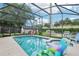A screened pool with hot tub and patio area, surrounded by a green, fenced backyard at 618 Acapulca Way, Altamonte Springs, FL 32714