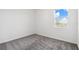 A carpeted bedroom includes a scenic window view at 716 Daring Dr, Davenport, FL 33837
