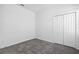Carpeted bedroom features a double door closet at 716 Daring Dr, Davenport, FL 33837