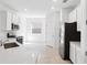 Modern kitchen featuring stainless steel appliances, white cabinets, and a quartz countertop at 716 Daring Dr, Davenport, FL 33837