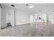 Expansive living area with tile floors connecting to kitchen and bedrooms at 716 Daring Dr, Davenport, FL 33837
