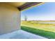Inviting covered patio with a serene view of the lush backyard and tranquil lake at 716 Daring Dr, Davenport, FL 33837
