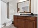 Elegant bathroom with a granite countertop, shower, and ample space at 7613 Cabana Ct # 102, Reunion, FL 34747