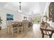 Open dining area with patio access and views of the living room and stylish decor at 7613 Cabana Ct # 102, Reunion, FL 34747