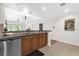 Open kitchen with stainless steel appliances, dark countertops, and modern lighting at 7613 Cabana Ct # 102, Reunion, FL 34747