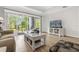 Cozy living room with patio access, featuring stylish furnishings and light wood flooring at 7613 Cabana Ct # 102, Reunion, FL 34747