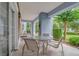 Outdoor patio featuring a table with seating and views of the manicured landscape at 7613 Cabana Ct # 102, Reunion, FL 34747
