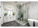 Modern bathroom with a glass shower, soaking tub, vanity, and sleek fixtures at 842 Creeping Fig St, Apopka, FL 32703