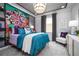 Fun bedroom with colorful wall art, stylish chandelier, and decorative accents throughout at 842 Creeping Fig St, Apopka, FL 32703