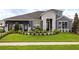 Charming single-Gathering home featuring a well-manicured lawn and stone accents at 842 Creeping Fig St, Apopka, FL 32703