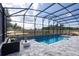 Beautiful screened pool and outdoor living space, with plenty of seating and tranquil views of the landscape at 842 Creeping Fig St, Apopka, FL 32703