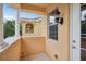 Outdoor balcony featuring stone railing, columns, and a view of the neighborhood at 8430 Leatherleaf Ln, Orlando, FL 32827