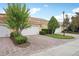 Exterior showcasing a brick driveway, two-car garage and lush landscaping at 8430 Leatherleaf Ln, Orlando, FL 32827