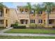 Attractive two-story home with tropical landscaping, well-manicured lawn, and a charming facade at 8430 Leatherleaf Ln, Orlando, FL 32827