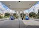 Clean gas station with two Mobil Synergy gas pumps beneath a modern white canopy in a residential neighborhood at 8430 Leatherleaf Ln, Orlando, FL 32827