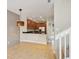 Open-concept kitchen with dark granite countertops and stainless steel appliances at 8430 Leatherleaf Ln, Orlando, FL 32827