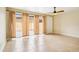 Bright living room with tile floors, ceiling fan, and sliding glass doors that lead to the patio at 8430 Leatherleaf Ln, Orlando, FL 32827