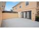 Spacious outdoor patio area with access to the home through sliding glass doors and a covered area at 8430 Leatherleaf Ln, Orlando, FL 32827