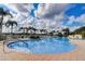 Resort-style pool with crystal-clear water, perfect for swimming and relaxation under the sunny sky at 8430 Leatherleaf Ln, Orlando, FL 32827