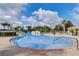 Beautiful community pool and lounging area, perfect for relaxing and enjoying the outdoors at 8430 Leatherleaf Ln, Orlando, FL 32827