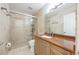 Contemporary bathroom featuring a glass-enclosed shower, wood vanity with countertop sink, and modern fixtures at 9062 Dancy Tree Ct, Orlando, FL 32836