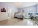bedroom with a cozy bed, butterfly mirror, and a comfortable beanbag chair at 9062 Dancy Tree Ct, Orlando, FL 32836