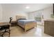 Bedroom featuring a wooden bed frame, desk, and a large window with natural light at 9062 Dancy Tree Ct, Orlando, FL 32836