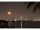Stunning nighttime view of the city skyline reflected on the water at 9062 Dancy Tree Ct, Orlando, FL 32836