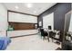 Modern office with a sleek desk, ample storage, and stylish decor, creating a productive and elegant workspace at 9062 Dancy Tree Ct, Orlando, FL 32836