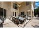 Screened outdoor patio area includes a dining table, grill and full outdoor kitchen at 9062 Dancy Tree Ct, Orlando, FL 32836