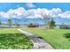 Scenic walkway and gazebo enhance the serene atmosphere of this waterfront community at 9062 Dancy Tree Ct, Orlando, FL 32836