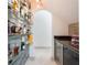 Wine cellar showcasing a glass-front cooler and illuminated display shelves filled with an assortment of wine bottles at 9062 Dancy Tree Ct, Orlando, FL 32836