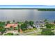 Panoramic aerial view of lakefront property with large homes and a serene lake in the background at 9146 Bay Point Dr, Orlando, FL 32819