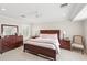 Bedroom with wood furniture, including a dresser, nightstands, and king-size bed at 9146 Bay Point Dr, Orlando, FL 32819