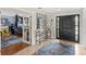 Light-filled foyer with decorative mirror, console, and doorway to office at 9146 Bay Point Dr, Orlando, FL 32819