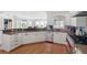 Charming kitchen with granite countertops, stainless steel appliances, and a breakfast bar open to the living area at 9146 Bay Point Dr, Orlando, FL 32819