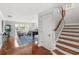 Bright living room with hard wood floors, stairway, and water views at 9146 Bay Point Dr, Orlando, FL 32819
