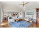 Bright living room boasts vaulted ceilings, hardwood floors, and an open floor plan to the kitchen and dining areas at 9146 Bay Point Dr, Orlando, FL 32819