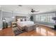Serene bedroom features water views, an updated ceiling fan, and a seating area, perfect for relaxation at 9146 Bay Point Dr, Orlando, FL 32819