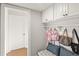 Functional mudroom with storage cabinets, hooks, and a bench, helping to keep your home organized and tidy at 9146 Bay Point Dr, Orlando, FL 32819