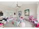 Bright playroom with a ceiling fan, soft carpet, and ample storage for toys at 9146 Bay Point Dr, Orlando, FL 32819