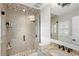 Modern bathroom with a tiled walk-in shower with glass door and granite vanity at 9146 Bay Point Dr, Orlando, FL 32819