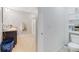 Bathroom featuring a granite sink, shower, and storage unit next to the toilet at 984 Chanler Dr, Haines City, FL 33844