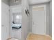 The foyer features tile flooring, white walls, and a glimpse into a bedroom with carpet at 984 Chanler Dr, Haines City, FL 33844