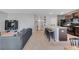 Spacious living area connects a comfortable sofa with the kitchen's island, and open floor plan, for entertaining at 984 Chanler Dr, Haines City, FL 33844