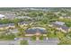 Aerial view featuring a community pool, clubhouse, and well-manicured grounds at 9900 Sweepstakes Ln # 1, Orlando, FL 32837
