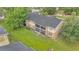 Back of building with a patio and screened in porch overlooking the community area at 9900 Sweepstakes Ln # 1, Orlando, FL 32837