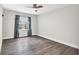 Bedroom with a neutral color palette, ceiling fan, and a window offering plenty of natural light at 9900 Sweepstakes Ln # 1, Orlando, FL 32837