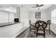Cozy dining room features a wooden table, unique chairs, and a stylish ceiling fan with a light at 9900 Sweepstakes Ln # 1, Orlando, FL 32837